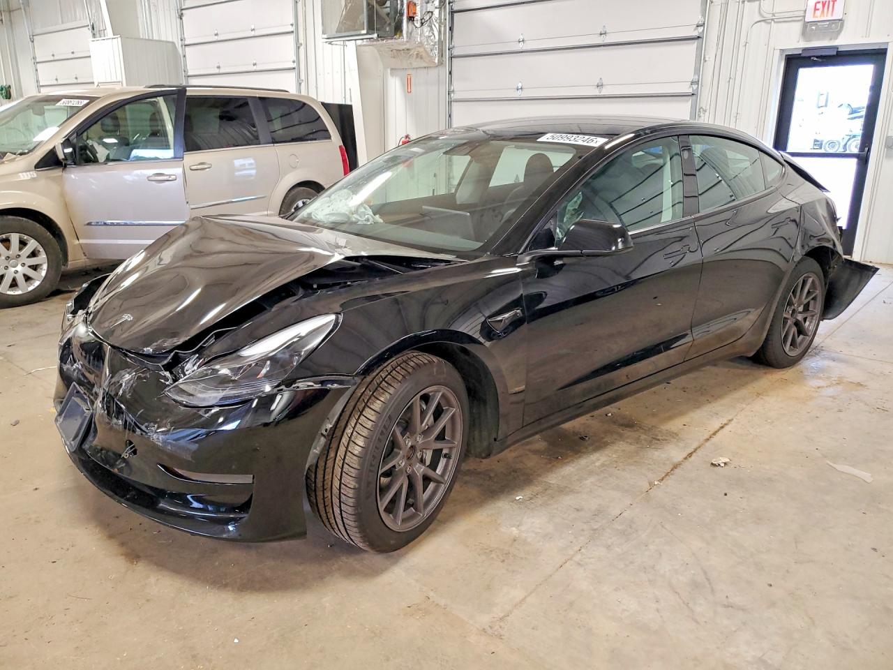 2023 Tesla Model 3 VIN 5YJ3E1EB7PF591423 COPART salvage auction — Rear End, MN - CERT OF TITLE-SALVAGE, sold $3,350 on 2026-05-28 (photo 1)