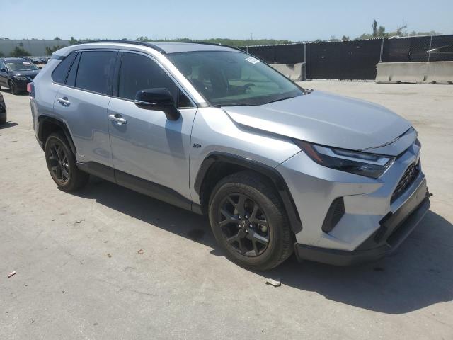 2023 Toyota Rav4 VIN JTMRWRFV2PD189265 COPART salvage auction — SIDE, Salvage Title, sold $11,000 on 2026-07-14 (photo 4)
