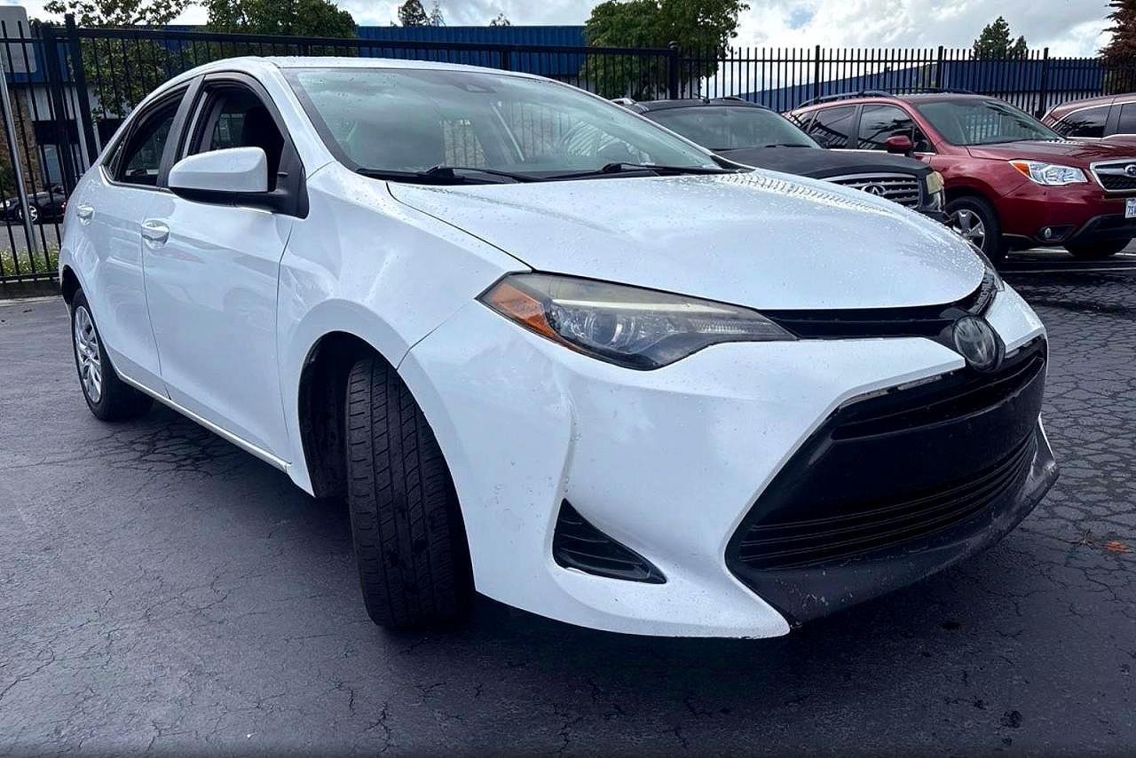 2018 Toyota Corolla VIN 5YFBURHE3JP840007 COPART salvage auction — Minor Dent/Scratches, CA - DIS/DLR/EXP ONLY CLEAN TITLE (P), sold $5,000 on 2026-06-18 (photo 1)