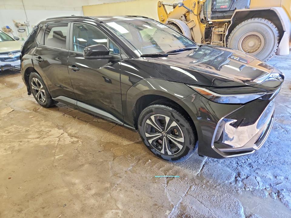 2024 Toyota Bz4x VIN JTMAAAAA7RA047693 COPART salvage auction — REAR END, MI - SCRAP CERTIFICATE OF TITLE, sold $8,400 on 2026-07-16 (photo 4)