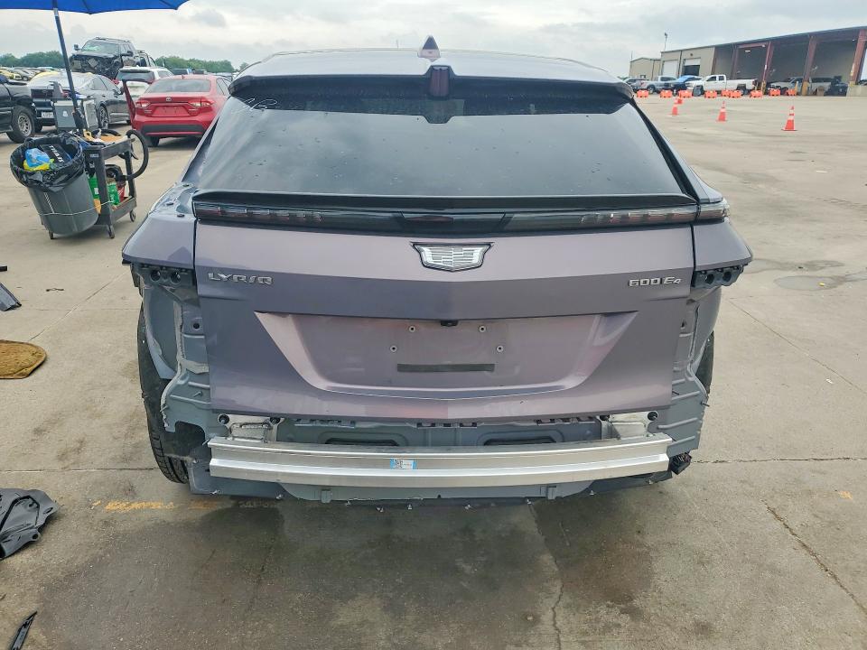 2024 Cadillac Lyriq VIN 1GYKPRRL4RZ131621 COPART salvage auction — SIDE, Tx - Salvage Vehicle Title, sold $16,600 on 2026-07-09 (photo 6)