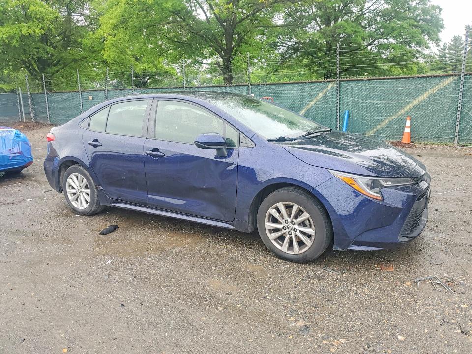 2023 Toyota Corolla VIN JTDB4MEEXPJ000391 COPART salvage auction — SIDE, Salvage Title, sold $4,250 on 2026-07-09 (photo 4)