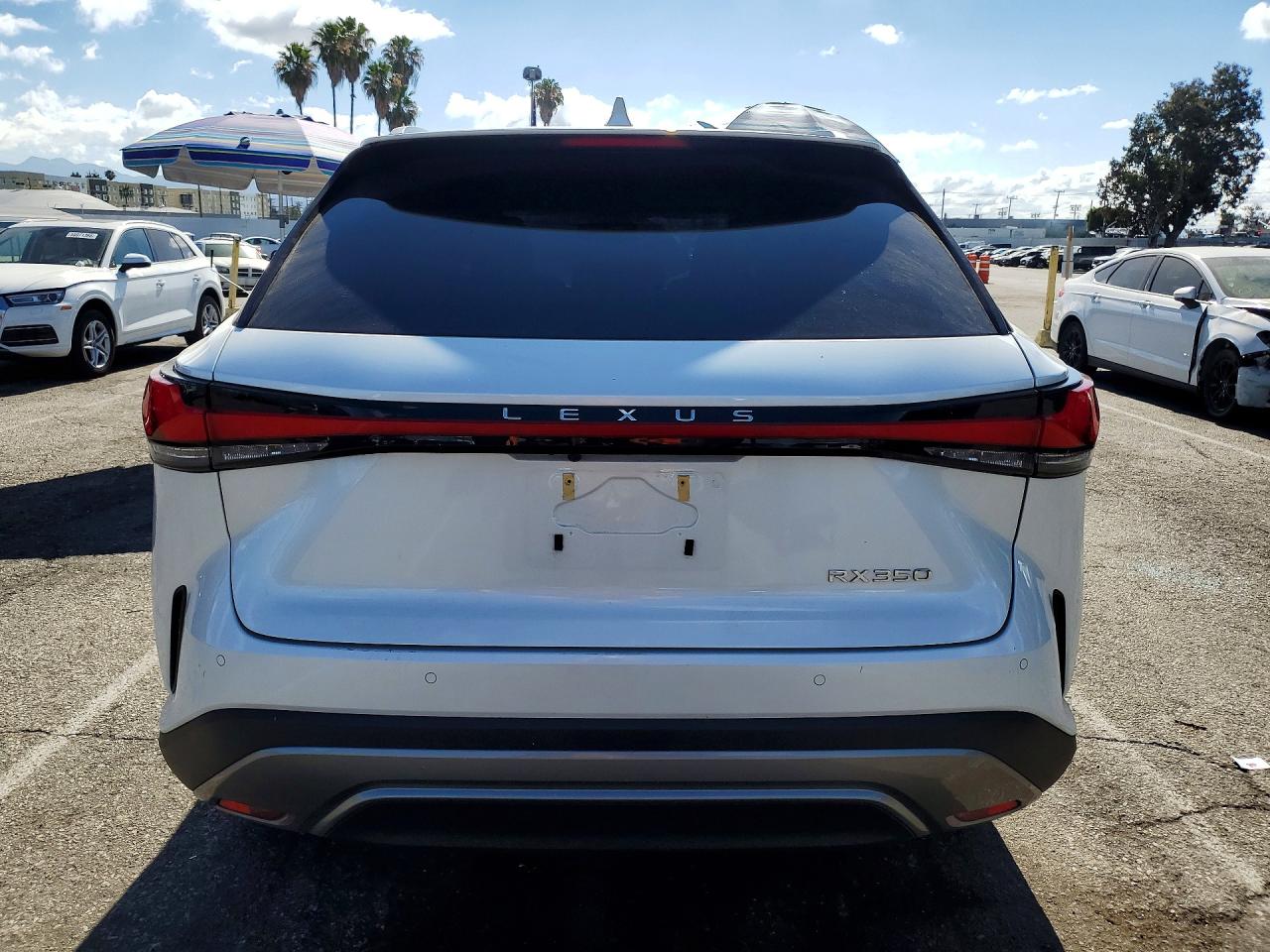 2024 Lexus RX 350 VIN JTJCHMAA7R2017221 COPART salvage auction — Side, CA - SALVAGE CERTIFICATE, sold $25,750 on 2026-07-10 (photo 6)