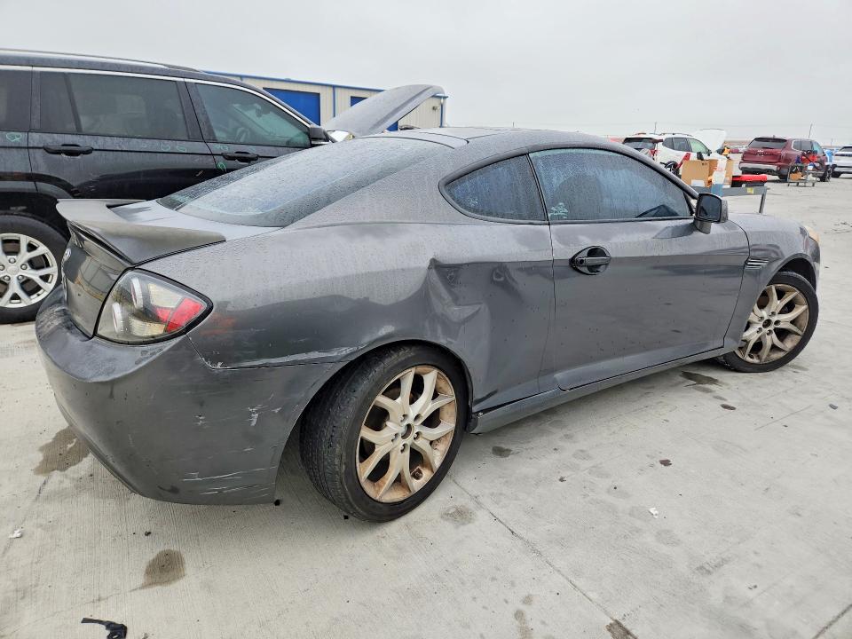 2007 Hyundai Tiburon VIN KMHHN66FX7U259922 COPART salvage auction — REAR END, TX - SALVAGE VEHICLE TITLE, sold $325 on 2026-07-31 (photo 3)
