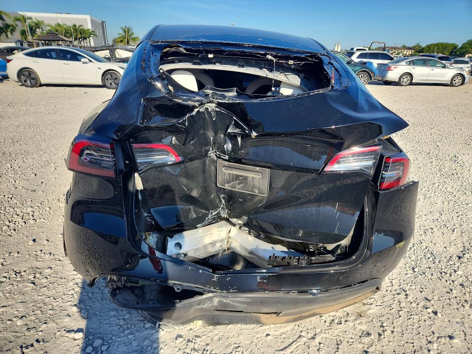 2024 Tesla Model y VIN 7SAYGDED7RF095045 COPART salvage auction — ALL OVER, Fl - Certificate Of Destruction, sold $3,150 on 2026-07-31 (photo 6)
