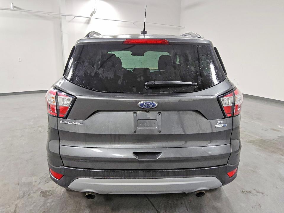 2018 Ford Escape VIN 1FMCU9GD1JUC10675 COPART salvage auction — MINOR DENT/SCRATCHES, MA - CERTIFICATE OF TITLE, sold $1,500 on 2026-07-09 (photo 6)