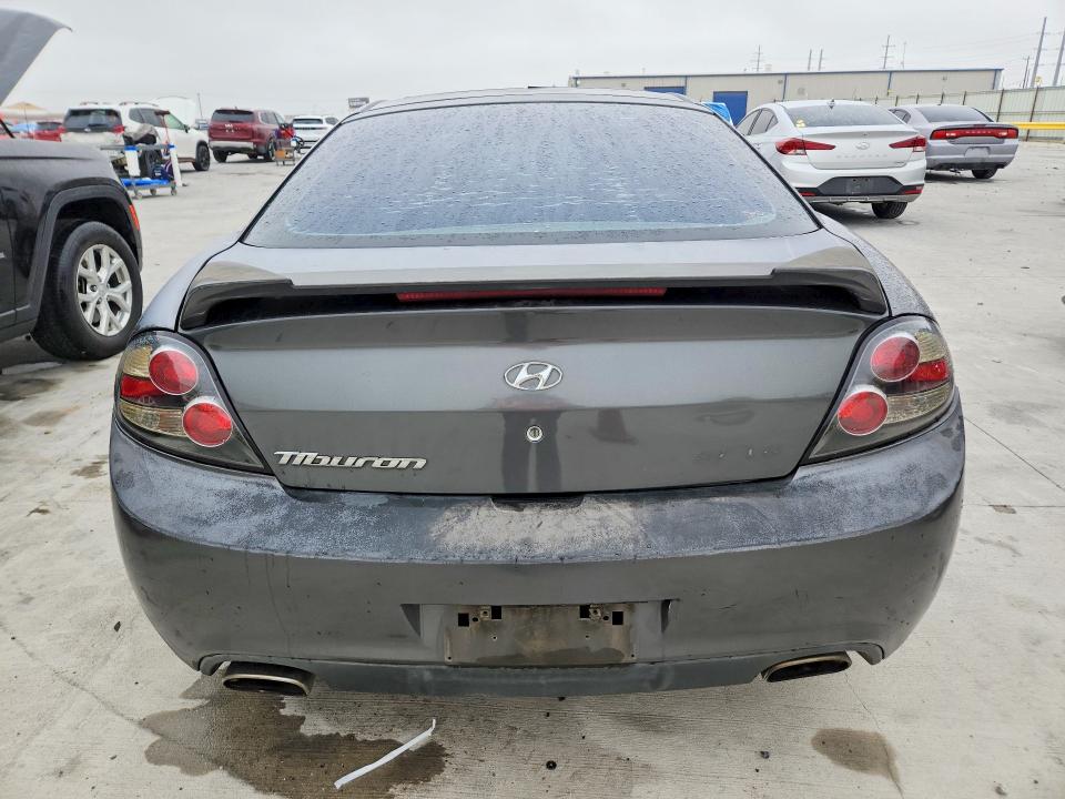2007 Hyundai Tiburon VIN KMHHN66FX7U259922 COPART salvage auction — REAR END, TX - SALVAGE VEHICLE TITLE, sold $325 on 2026-07-31 (photo 6)