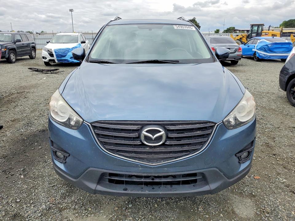 2016 Mazda VIN JM3KE2CY2G0792967 COPART salvage auction — SIDE, Ca - Salvage Certificate, sold $4,000 on 2026-07-02 (photo 5)