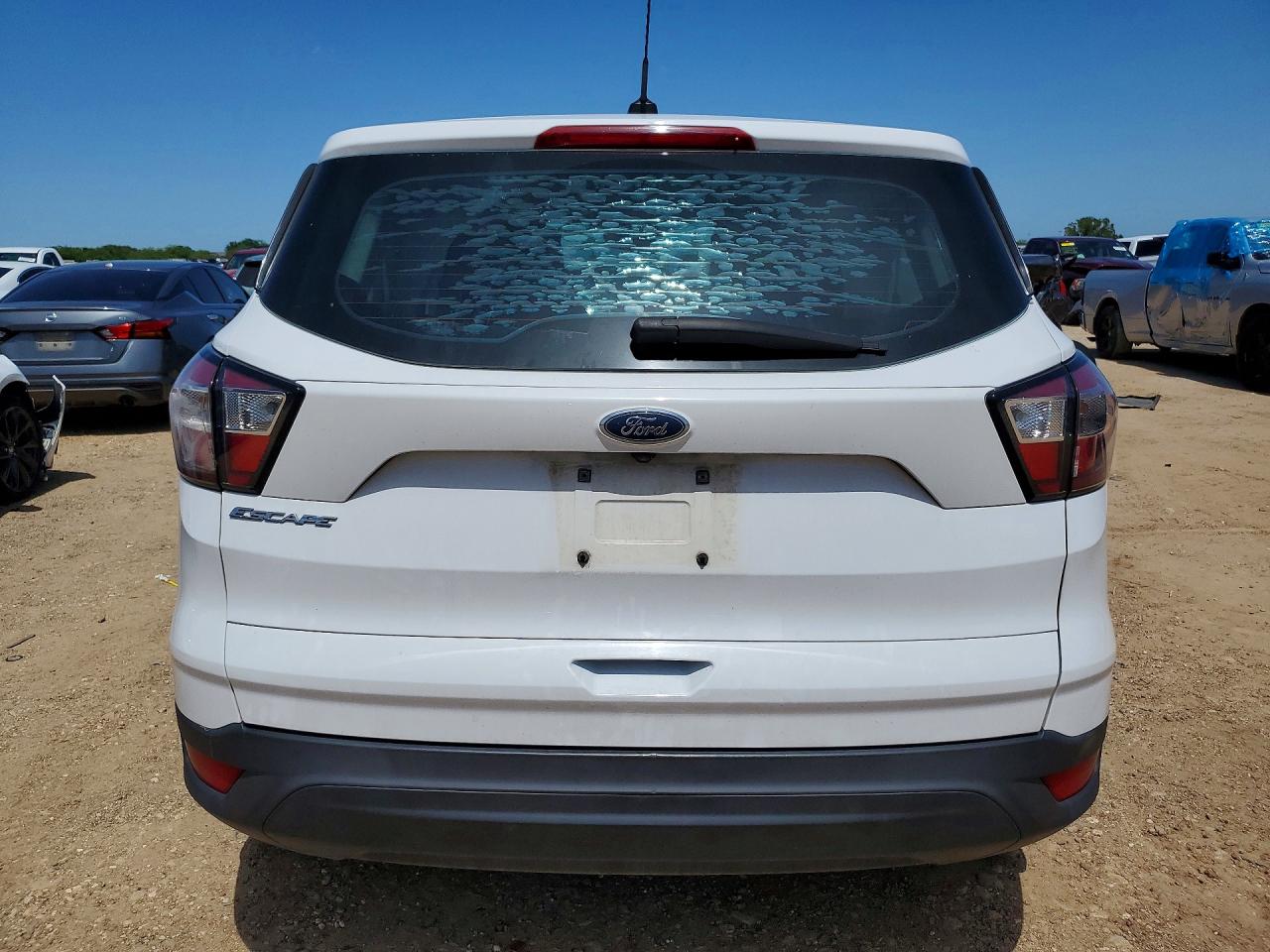 2017 Ford Escape VIN 1FMCU0F70HUD10316 COPART salvage auction — Side, TX - SALVAGE VEHICLE TITLE, sold $1,150 on 2026-07-09 (photo 6)