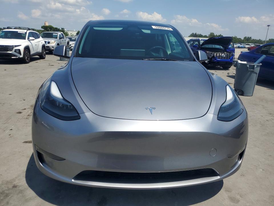 2024 Tesla Model y VIN 7SAYGDEEXRA320838 COPART salvage auction — MINOR DENT/SCRATCHES, Tx - Certificate Of Title (P), sold $20,600 on 2026-07-13 (photo 5)