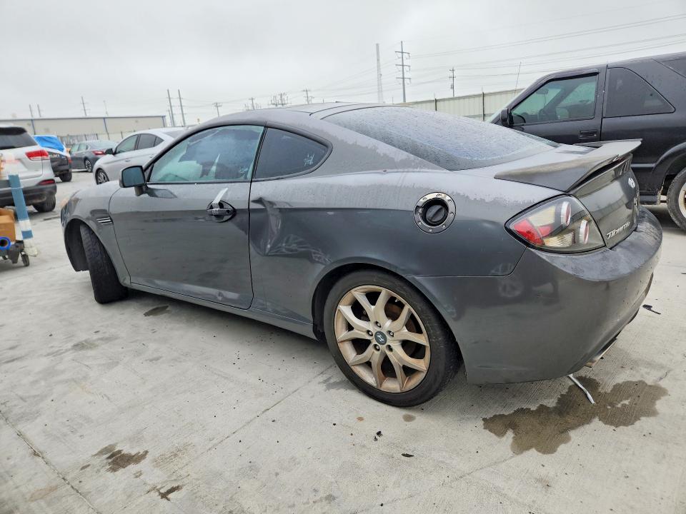 2007 Hyundai Tiburon VIN KMHHN66FX7U259922 COPART salvage auction — REAR END, TX - SALVAGE VEHICLE TITLE, sold $325 on 2026-07-31 (photo 2)