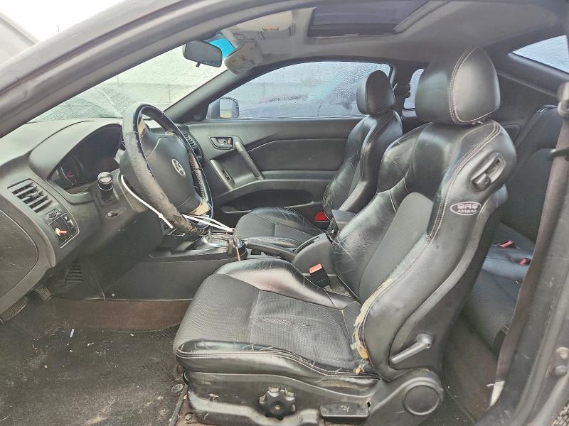 2007 Hyundai Tiburon VIN KMHHN66FX7U259922 COPART salvage auction — REAR END, TX - SALVAGE VEHICLE TITLE, sold $325 on 2026-07-31 (photo 7)
