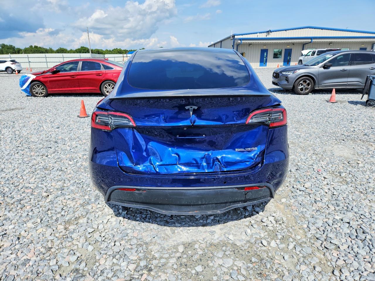 2022 Tesla Model Y VIN 7SAYGDEF3NF372818 COPART salvage auction — Rear End, FL - CERT OF TITLE SLVG REBUILDABLE, sold $12,500 on 2026-07-03 (photo 6)