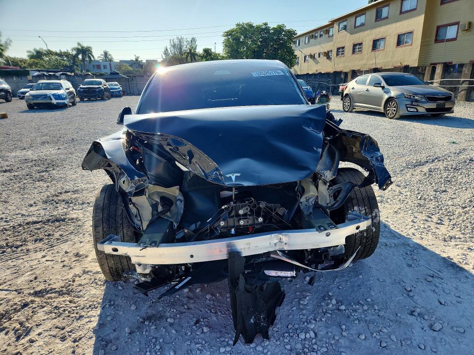 2024 Tesla Model y VIN 7SAYGDED7RF095045 COPART salvage auction — ALL OVER, Fl - Certificate Of Destruction, sold $3,150 on 2026-07-31 (photo 5)