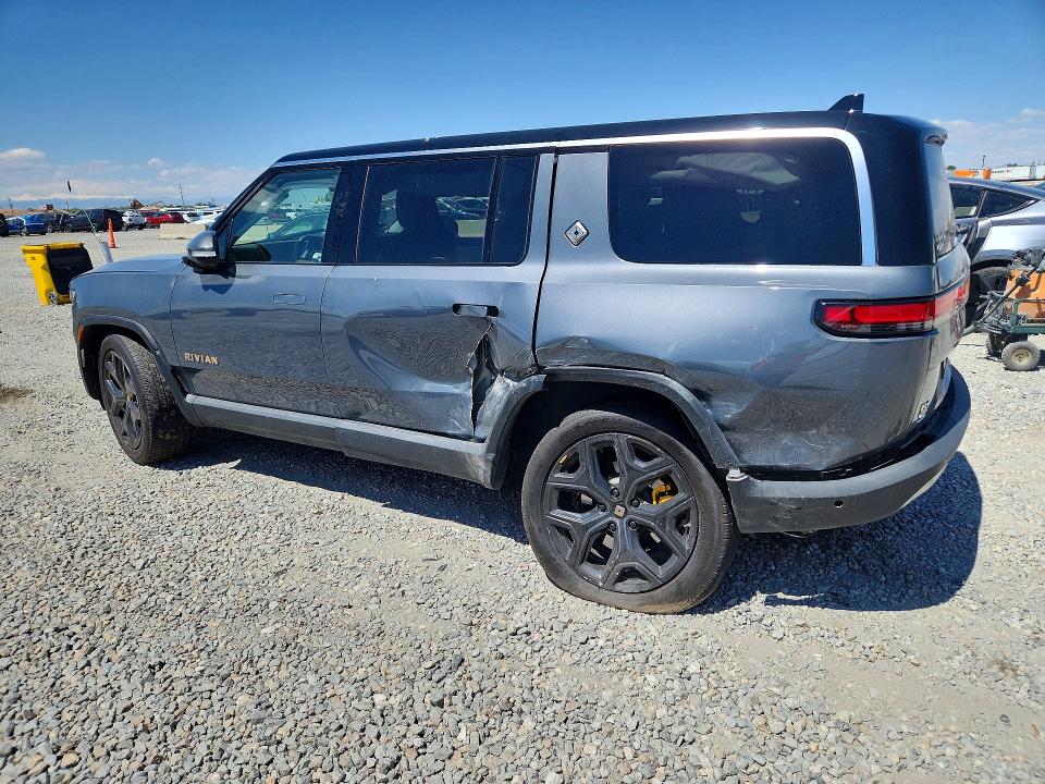 2023 Rivian VIN 7PDSGABA8PN010149 COPART salvage auction — SIDE, Salvage Title, sold $21,600 on 2026-08-13 (photo 2)