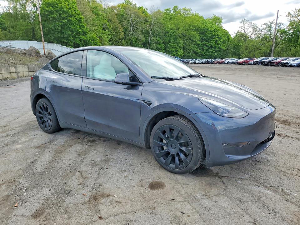 2023 Tesla Model y VIN 7SAYGDEE6PF868433 COPART salvage auction — SIDE, NY - MV-907A SALVAGE CERTIFICATE, sold $7,500 on 2026-07-28 (photo 4)