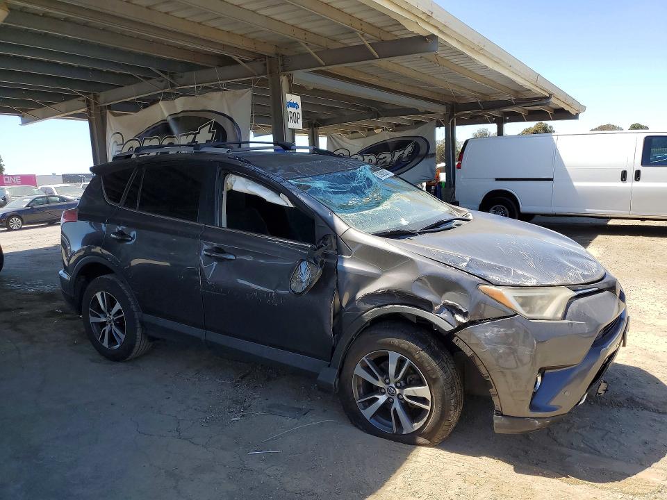 2016 Toyota Rav4 VIN JTMWFREV9GJ084180 COPART salvage auction — ALL OVER, Ca - Salvage Certificate, sold $2,450 on 2026-07-02 (photo 4)