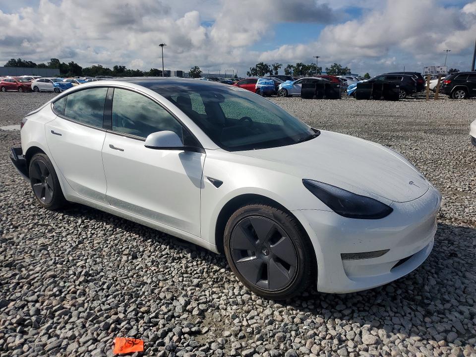 2023 Tesla Model 3 VIN 5YJ3E1EA4PF410737 COPART salvage auction — REAR END, Fl - Cert Of Title Slvg Rebuildable, sold $9,300 on 2026-07-13 (photo 4)