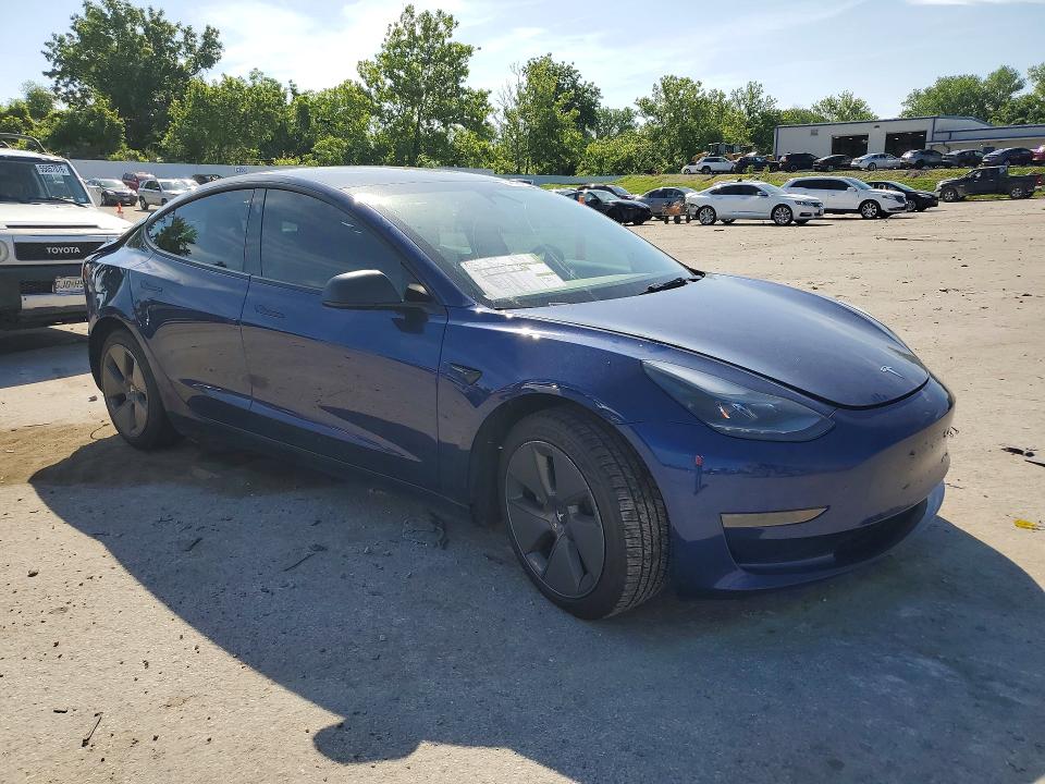 2023 Tesla Model 3 VIN 5YJ3E1EA9PF490794 COPART salvage auction — REAR END, Salvage Title, sold $7,400 on 2026-09-01 (photo 4)