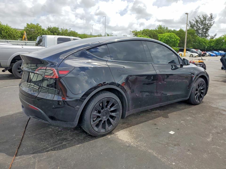 2023 Tesla Model y VIN 7SAYGDEE5PA078442 COPART salvage auction — SIDE, Fl - Cert Of Title Slvg Rebuildable, sold $11,900 on 2026-07-13 (photo 3)