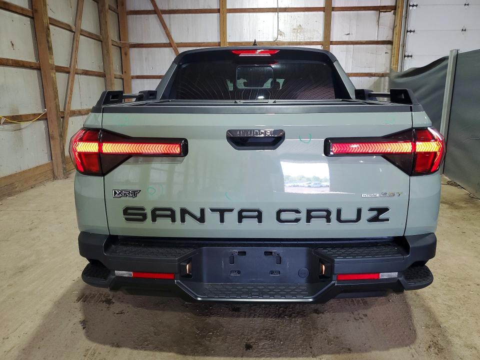 2024 Hyundai Santa cruz VIN 5NTJDDDF9RH104311 COPART salvage auction — HAIL, Oh - Cert Of Title-Salvage, sold $16,500 on 2026-07-09 (photo 6)