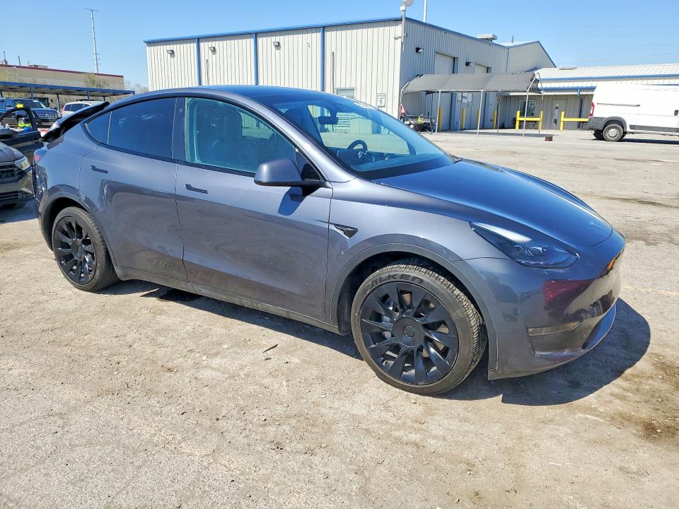2023 Tesla Model y VIN 7SAYGAEE6PF700385 COPART salvage auction — REAR END, Ut - Salvage Certificate, sold $9,400 on 2026-08-27 (photo 4)