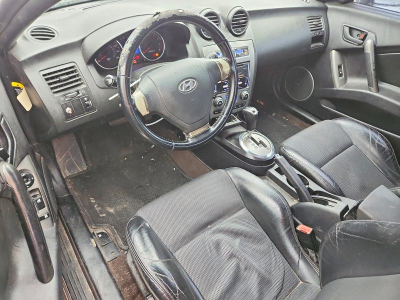 2007 Hyundai Tiburon VIN KMHHN66FX7U259922 COPART salvage auction — REAR END, TX - SALVAGE VEHICLE TITLE, sold $325 on 2026-07-31 (photo 8)