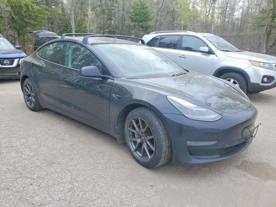 2021 Tesla Model 3 VIN 5YJ3E1EA6MF016944 COPART salvage auction — SIDE, On - Permit No Brand - Unfit, sold $7,200 on 2026-07-16 (photo 4)