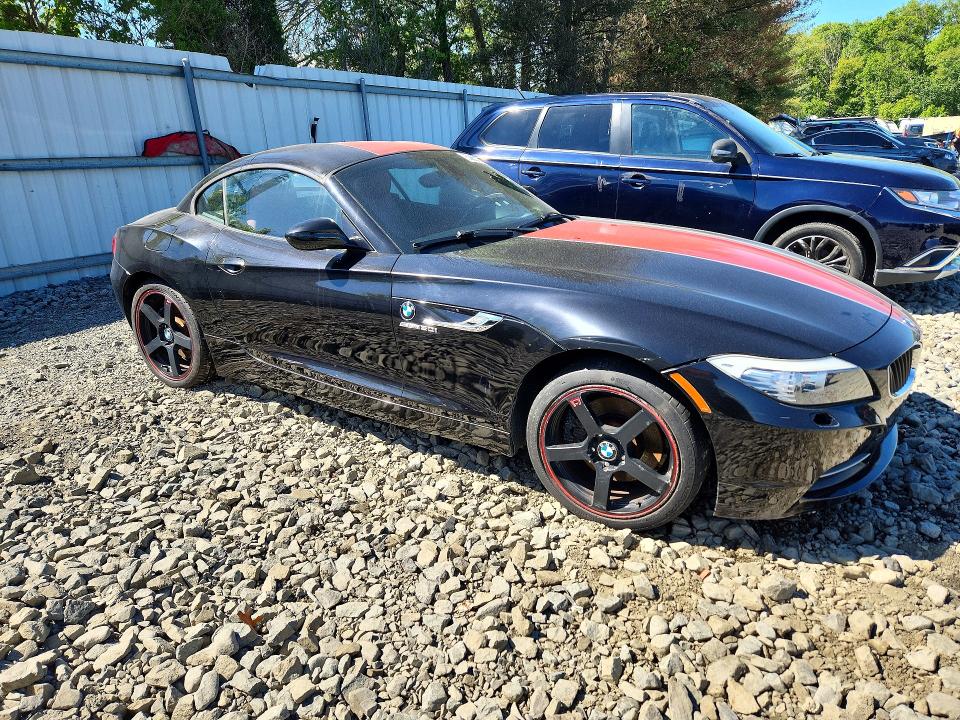 2011 BMW Z4 VIN WBALM5C59BE495940 COPART salvage auction — MINOR DENT/SCRATCHES, Fl - Cert Of Ttl-Rebuilt&Slvg Rbld (P), sold $2,700 on 2026-07-08 (photo 4)
