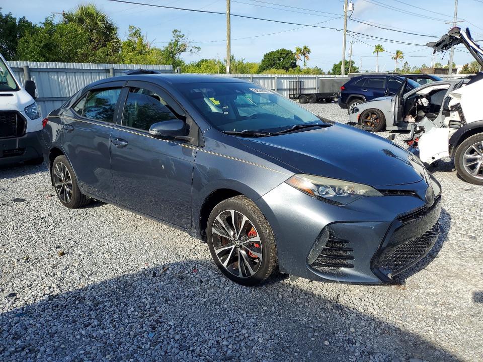 2018 Toyota Corolla VIN 5YFBURHEXJP842546 COPART salvage auction — SIDE, Fl - Cert Of Title Slvg Rebuildable, sold $3,250 on 2026-07-17 (photo 4)