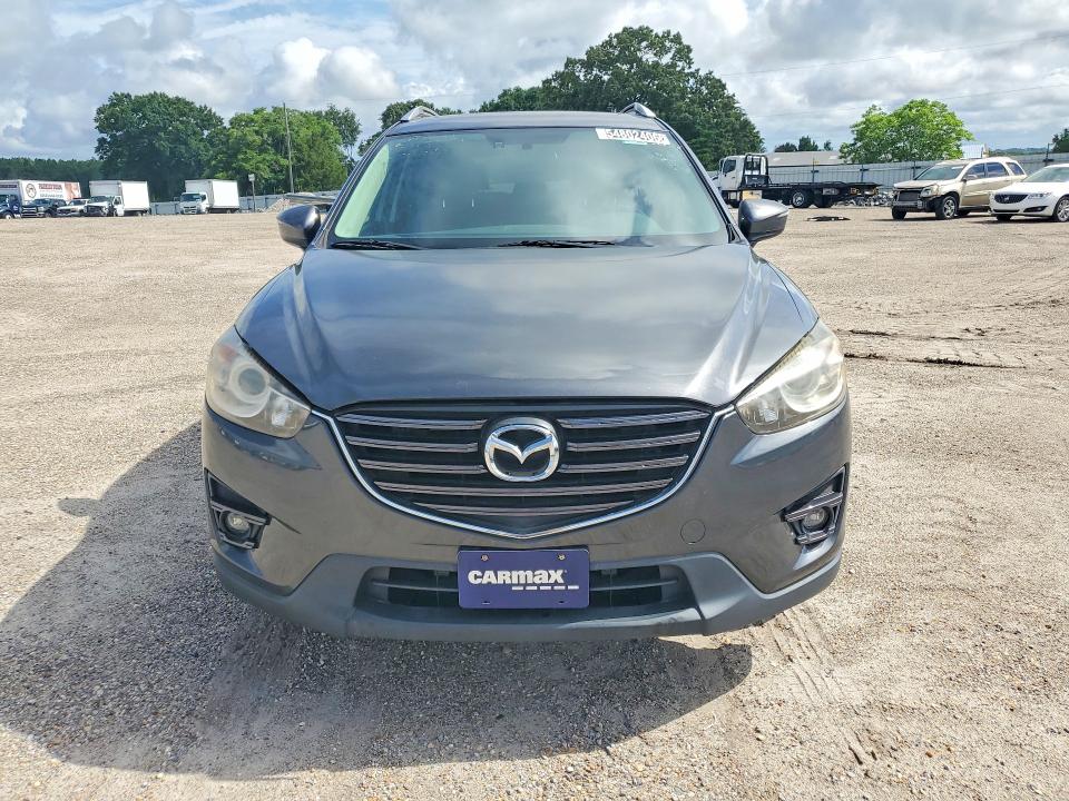 2016 Mazda Cx-5 VIN JM3KE4DY8G0834536 COPART salvage auction — NORMAL WEAR, Fl - Certificate Of Title, sold $8,200 on 2026-07-07 (photo 5)
