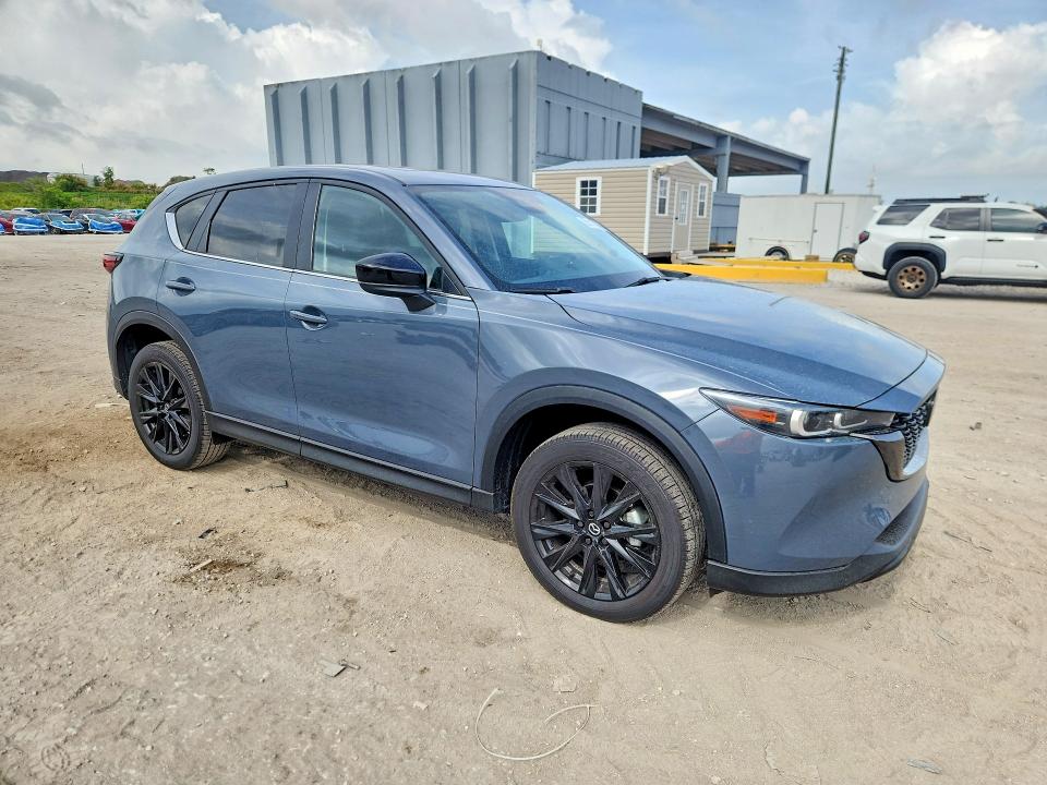 2025 Mazda Cx-5 VIN JM3KFBCM8S0611597 COPART salvage auction — SIDE, Fl - Cert Of Title Slvg Rebuildable, sold $12,200 on 2026-07-16 (photo 4)