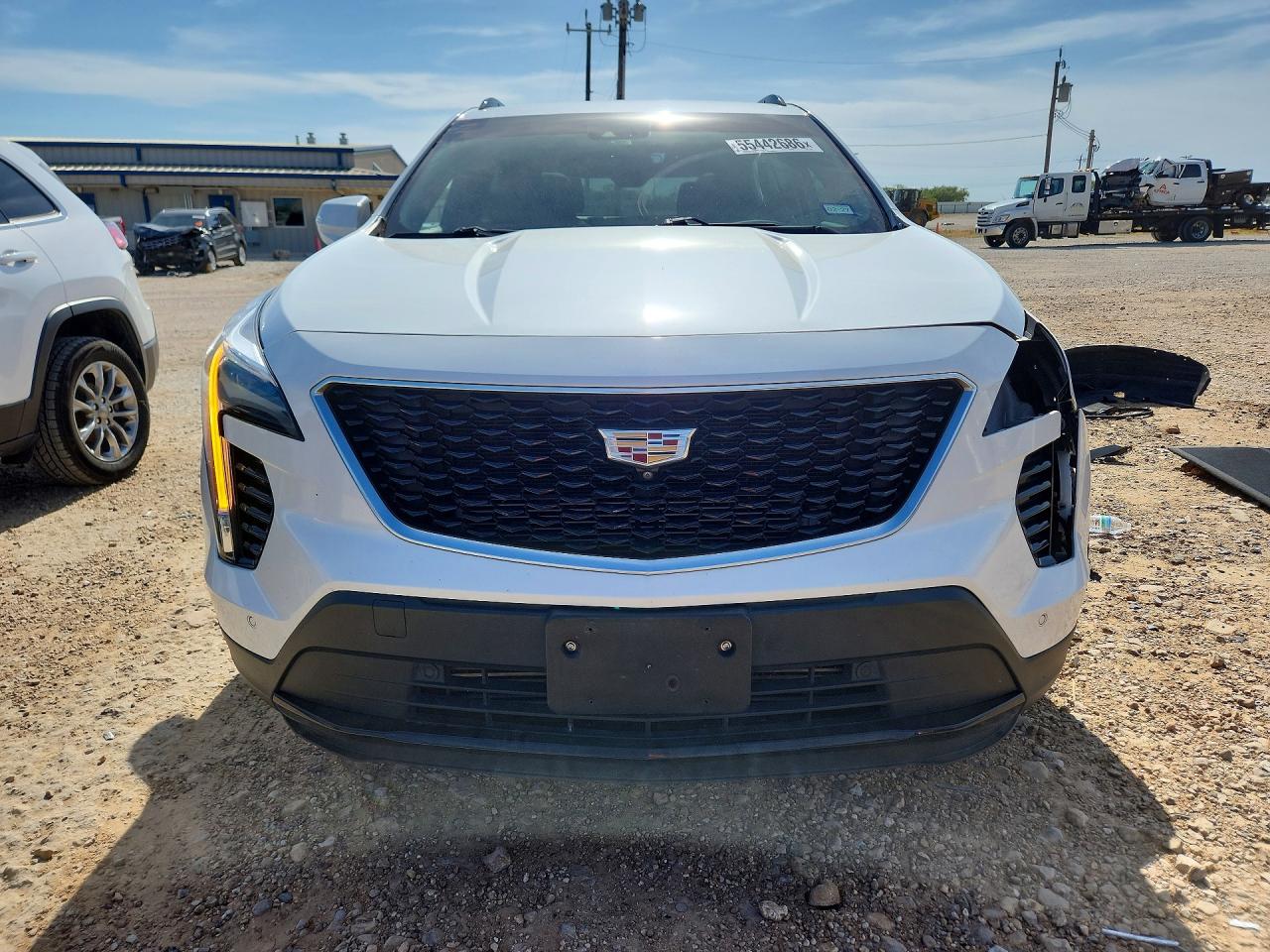 2022 Cadillac XT4 VIN 1GYFZER42NF113627 COPART salvage auction — Side, TX - SALVAGE VEHICLE TITLE, sold $6,400 on 2026-07-09 (photo 5)