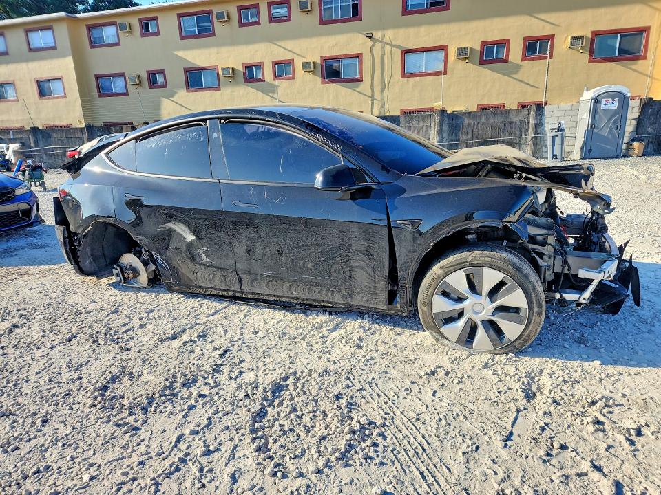 2024 Tesla Model y VIN 7SAYGDED7RF095045 COPART salvage auction — ALL OVER, Fl - Certificate Of Destruction, sold $3,150 on 2026-07-31 (photo 4)