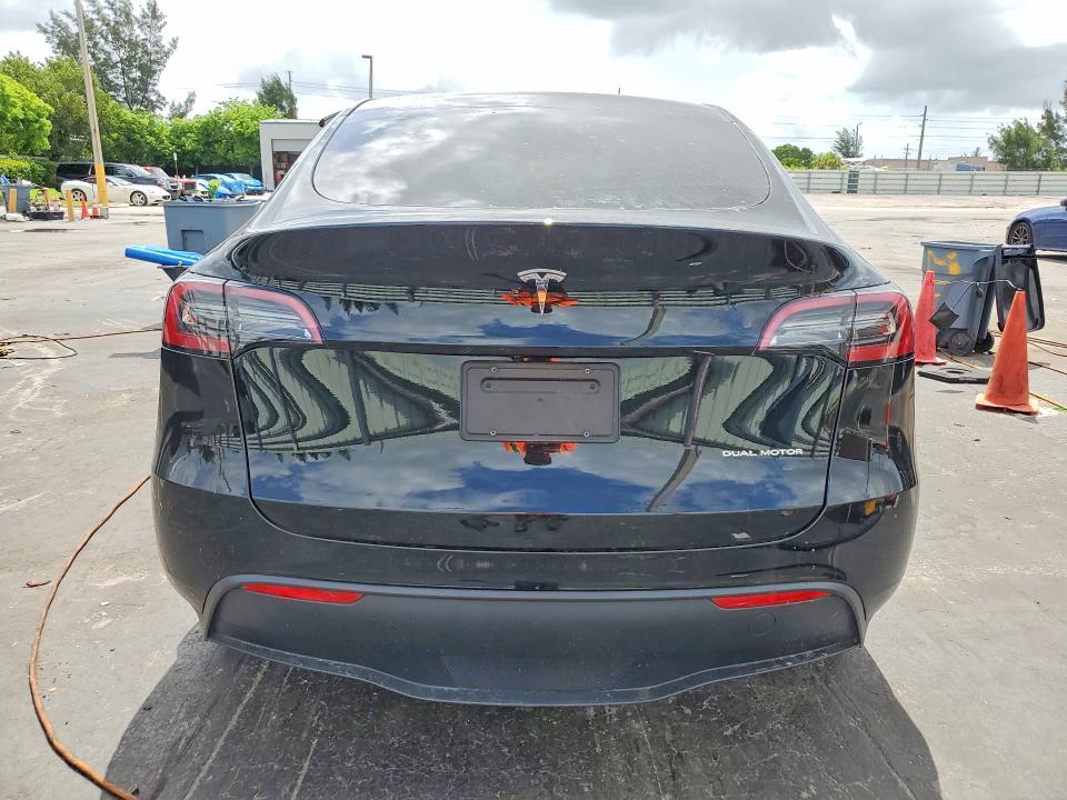 2023 Tesla Model y VIN 7SAYGDEE5PA078442 COPART salvage auction — SIDE, Fl - Cert Of Title Slvg Rebuildable, sold $11,900 on 2026-07-13 (photo 6)