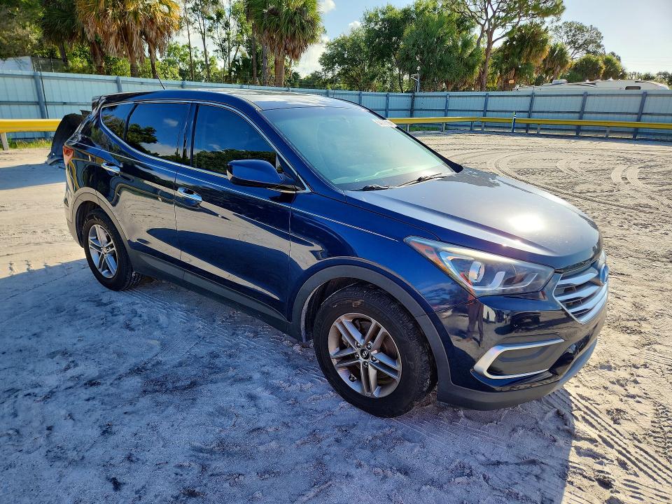 2018 Hyundai Santa fe VIN 5XYZT3LB7JG565743 COPART salvage auction — WATER/FLOOD, Fl - Cert Of Title-Slvg Rebld Flood, sold $3,650 on 2026-07-08 (photo 4)