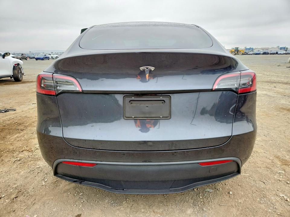 2025 Tesla Model y VIN 7SAYGDED0SF253523 COPART salvage auction — SIDE, Ca - Salvage Certificate, sold $13,600 on 2026-07-24 (photo 6)