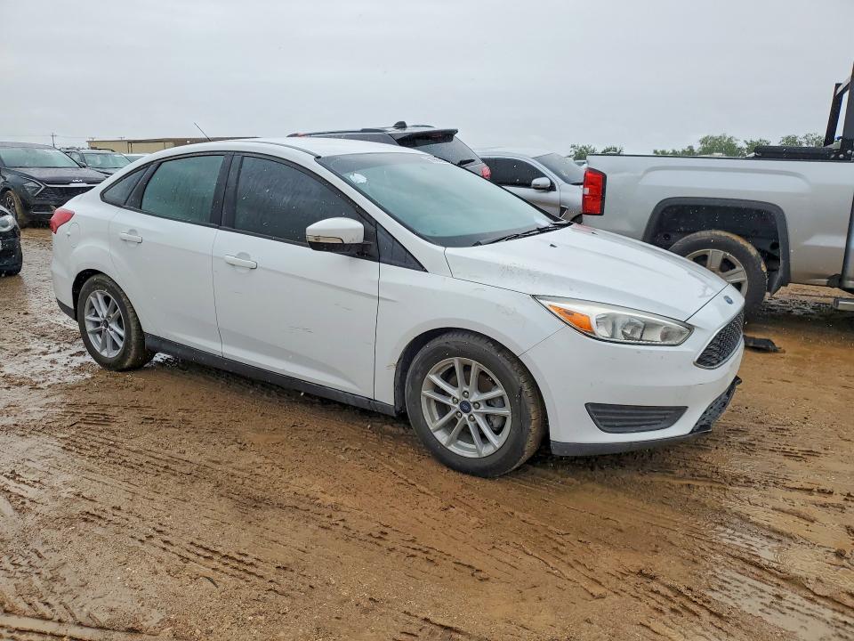 2017 Ford Focus VIN 1FADP3F27HL300674 COPART salvage auction — SIDE, Tx - Salvage Vehicle Title, sold $2,900 on 2026-07-02 (photo 4)