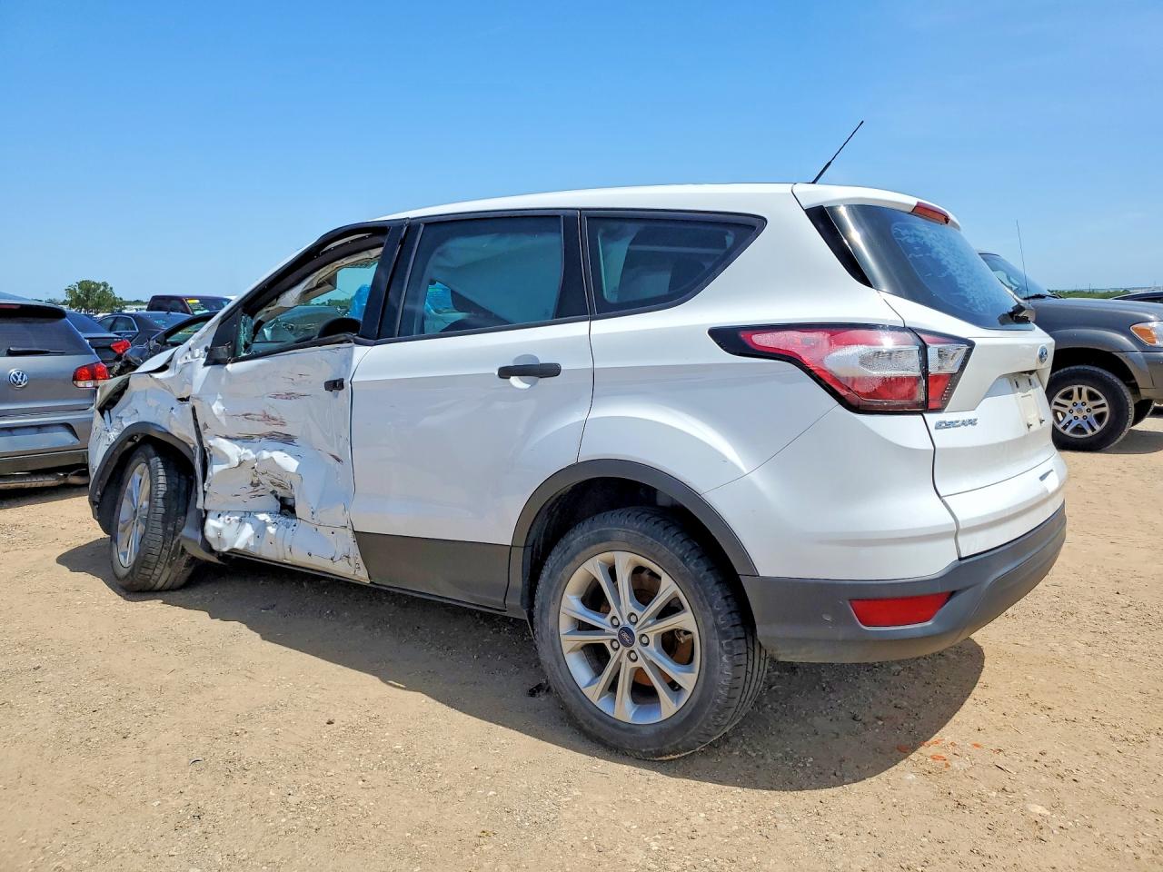 2017 Ford Escape VIN 1FMCU0F70HUD10316 COPART salvage auction — Side, TX - SALVAGE VEHICLE TITLE, sold $1,150 on 2026-07-09 (photo 2)