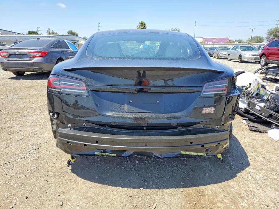 2026 Tesla Model S VIN 5YJSA1E60TF562074 COPART salvage auction — All Over, CA - SALVAGE CERTIFICATE, sold $44,000 on 2026-06-26 (photo 6)