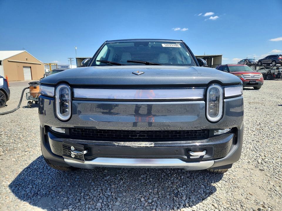 2023 Rivian VIN 7PDSGABA8PN010149 COPART salvage auction — SIDE, Salvage Title, sold $21,600 on 2026-08-13 (photo 5)