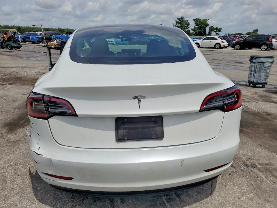 2023 Tesla Model 3 VIN 5YJ3E1EA6PF656060 COPART salvage auction — REAR END, Fl - Cert Of Title Slvg Rebuildable, sold $7,600 on 2026-07-14 (photo 6)