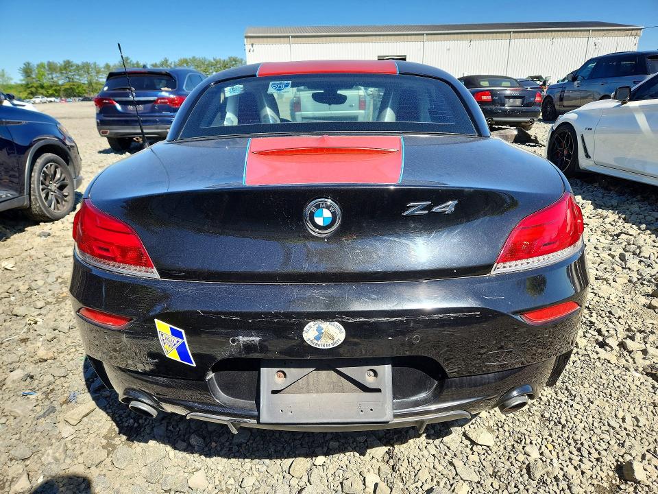 2011 BMW Z4 VIN WBALM5C59BE495940 COPART salvage auction — MINOR DENT/SCRATCHES, Fl - Cert Of Ttl-Rebuilt&Slvg Rbld (P), sold $2,700 on 2026-07-08 (photo 6)