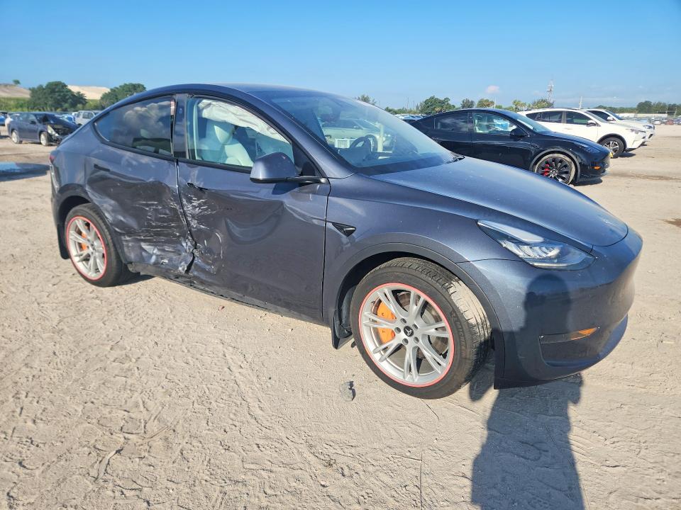2023 Tesla VIN 7SAYGDEE5PA161434 COPART salvage auction — SIDE, FL - CERT OF TITLE SLVG REBUILDABLE, sold $9,700 on 2026-07-02 (photo 4)