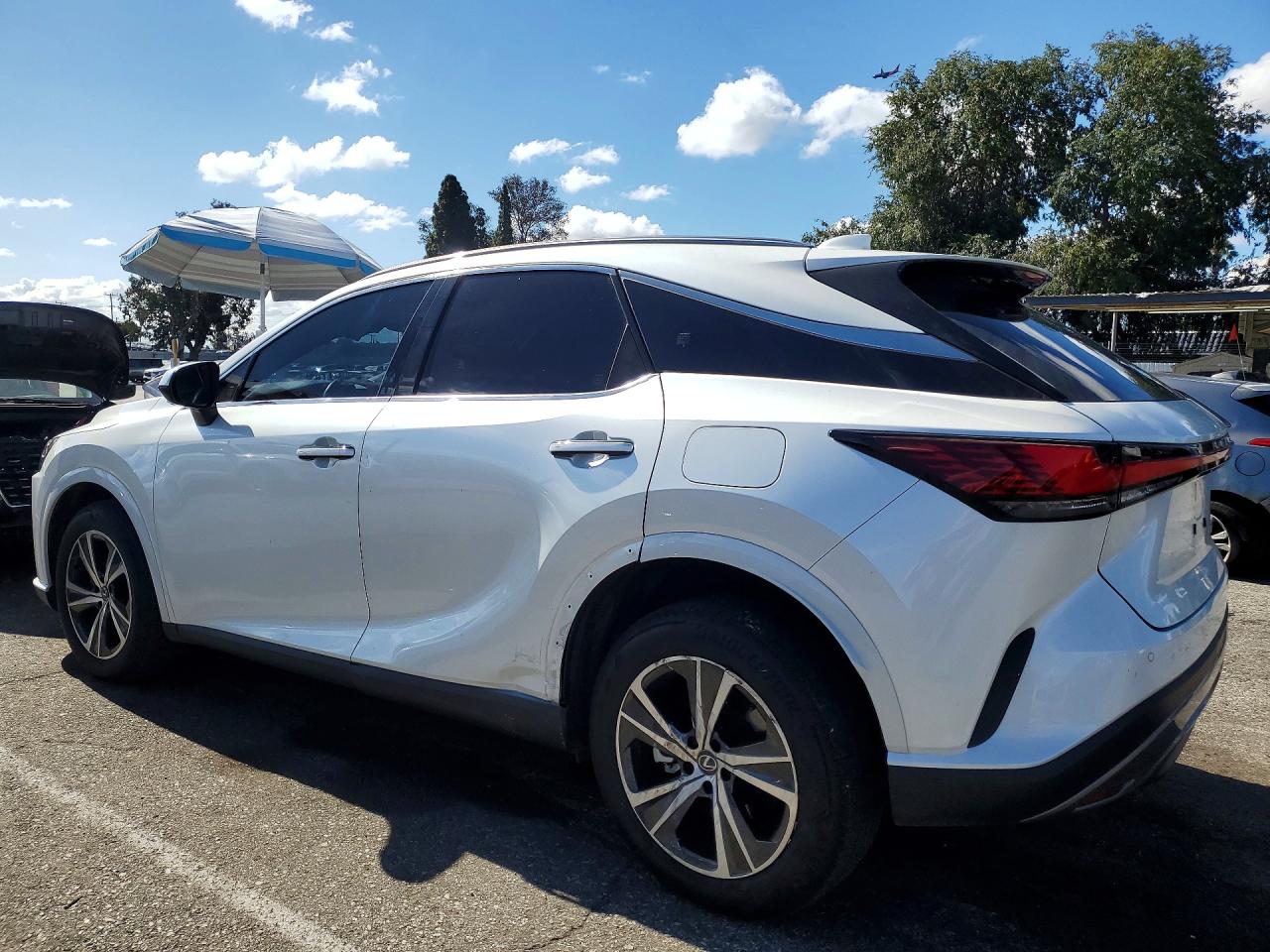 2024 Lexus RX 350 VIN JTJCHMAA7R2017221 COPART salvage auction — Side, CA - SALVAGE CERTIFICATE, sold $25,750 on 2026-07-10 (photo 2)