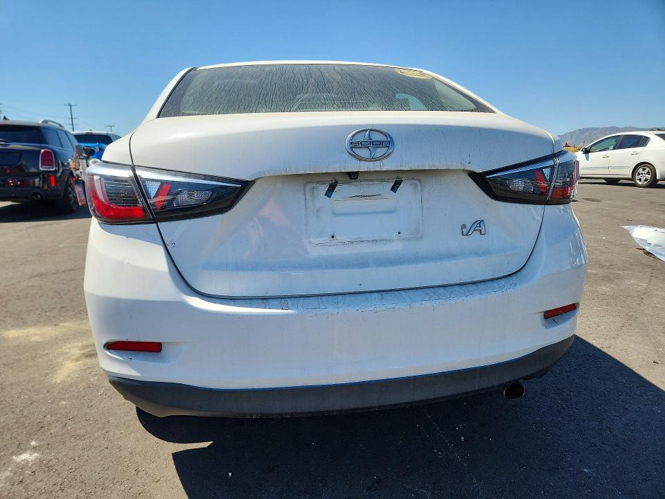 2016 Scion Ia VIN 3MYDLBZV7GY124853 COPART salvage auction — MECHANICAL, Ca - Dis/Dlr/Exp Clean W/Salv Hist, sold $725 on 2026-07-08 (photo 6)