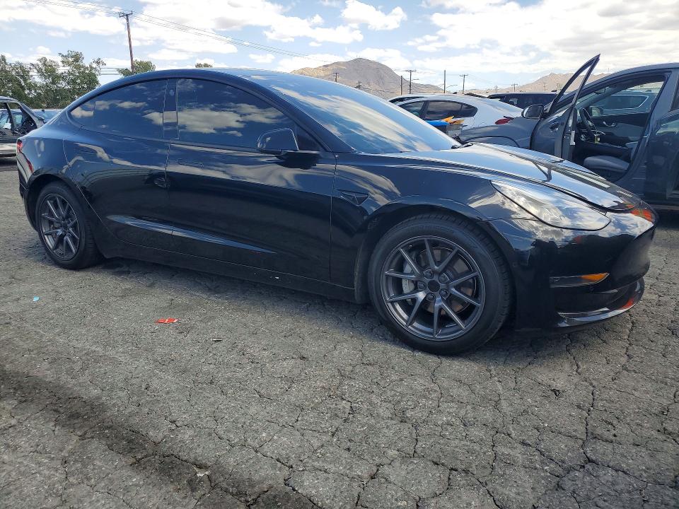 2021 Tesla Model 3 VIN 5YJ3E1EAXMF943011 COPART salvage auction — SIDE, Ca - Salvage Certificate, sold $5,600 on 2026-07-16 (photo 4)