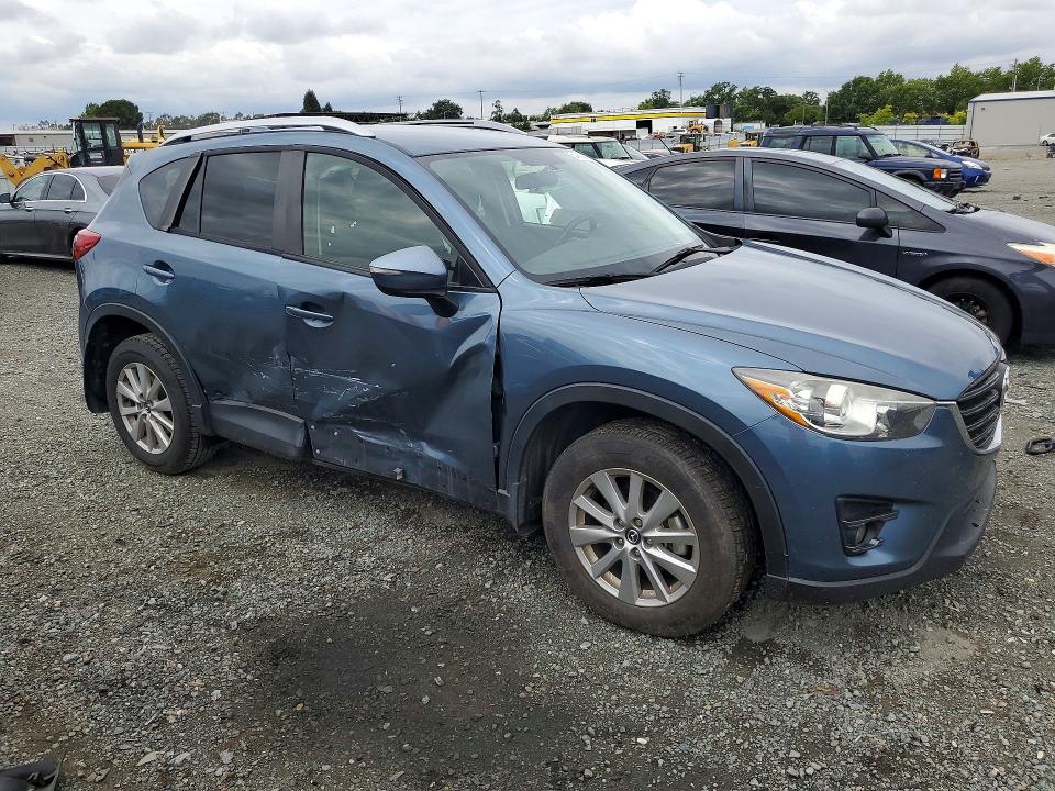 2016 Mazda VIN JM3KE2CY2G0792967 COPART salvage auction — SIDE, Ca - Salvage Certificate, sold $4,000 on 2026-07-02 (photo 4)