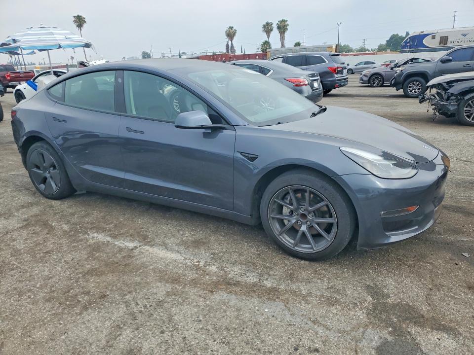 2023 Tesla Model 3 VIN 5YJ3E1EAXPF429115 COPART salvage auction — SIDE, ID - SALVAGE CERTIFICATE OF TITLE, sold $6,700 on 2026-07-31 (photo 4)