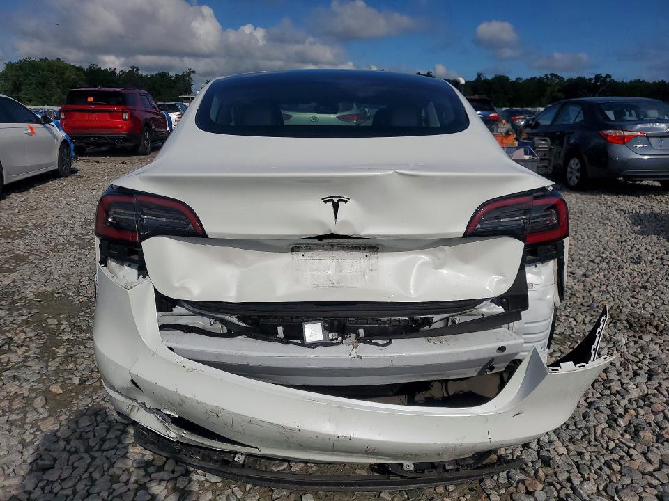 2023 Tesla Model 3 VIN 5YJ3E1EA4PF410737 COPART salvage auction — REAR END, Fl - Cert Of Title Slvg Rebuildable, sold $9,300 on 2026-07-13 (photo 6)